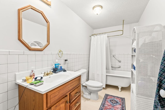 114 Woodiel Cir, Cabot, AR 72023 - bathroom featuring tile walls, vanity, a textured ceiling, a wainscoted wall, and shower / bath combo