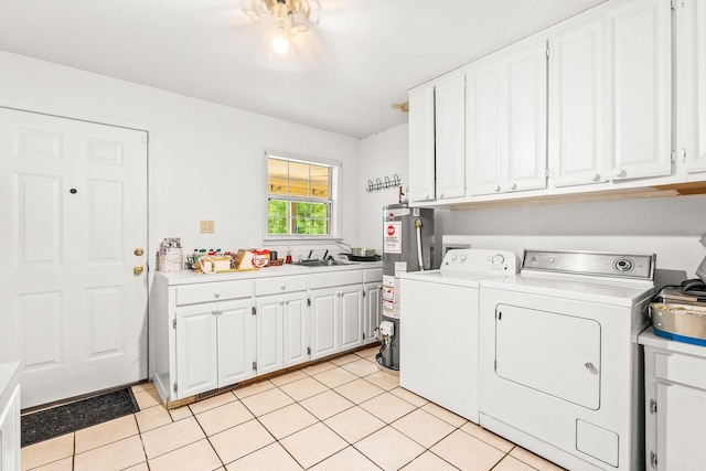 114 Woodiel Cir, Cabot, AR 72023 - laundry room featuring washer and clothes dryer, cabinet space, gas water heater, and light tile patterned floors