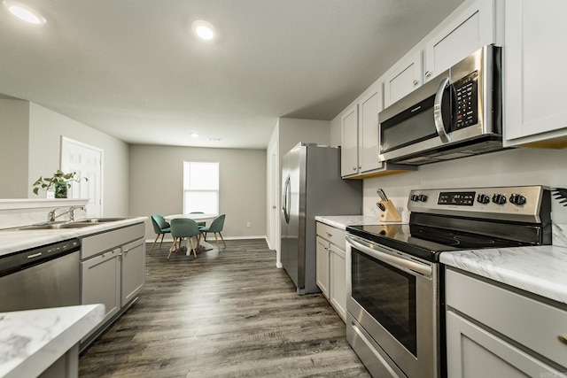 53 Dunnaway Dr, Ward, AR 72176 - kitchen with stainless steel appliances, dark wood-style flooring, recessed lighting, and gray cabinets
