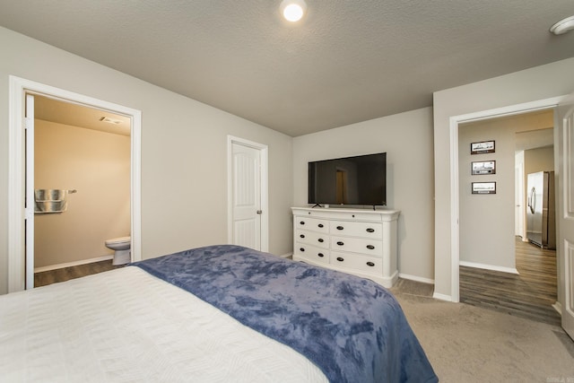 53 Dunnaway Dr, Ward, AR 72176 - carpeted bedroom featuring freestanding refrigerator and connected bathroom