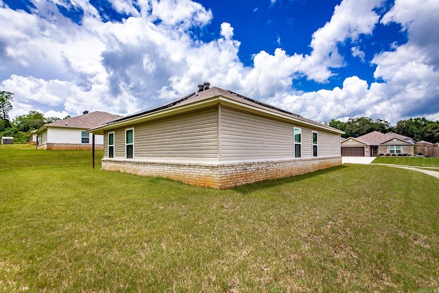 53 Dunnaway Dr, Ward, AR 72176 - view of property exterior featuring roof mounted solar panels and a yard