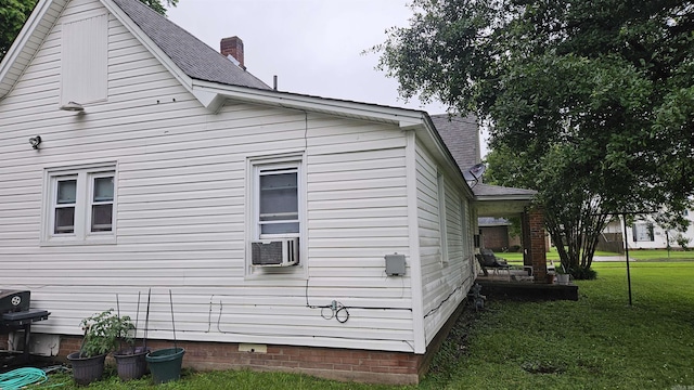 121 W 5th St, Rector, AR 72461 - view of side of property featuring crawl space, a yard, cooling unit, and a shingled roof