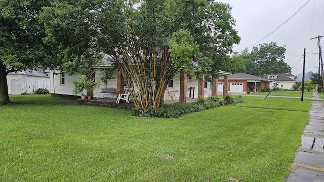 121 W 5th St, Rector, AR 72461 - view of front of house with a porch, a front lawn, and a garage