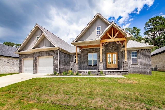 19 Denali Dr, Cabot, AR 72023 - craftsman inspired home featuring board and batten siding, brick siding, an attached garage, a front lawn, and driveway