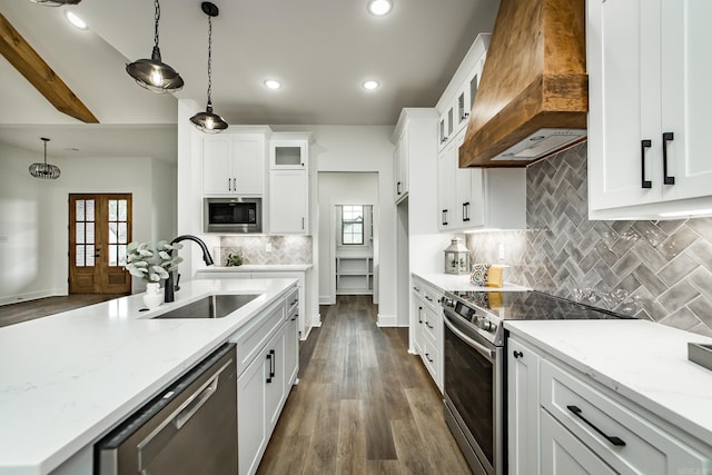 19 Denali Dr, Cabot, AR 72023 - kitchen featuring stainless steel appliances, custom range hood, plenty of natural light, white cabinets, and recessed lighting
