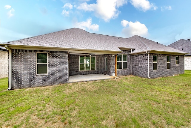 19 Denali Dr, Cabot, AR 72023 - back of house with a shingled roof, brick siding, a patio, and a yard