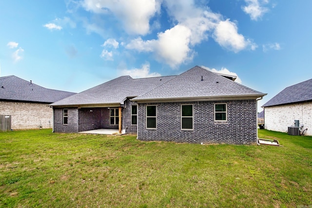 19 Denali Dr, Cabot, AR 72023 - back of house with a patio, a shingled roof, a lawn, and brick siding