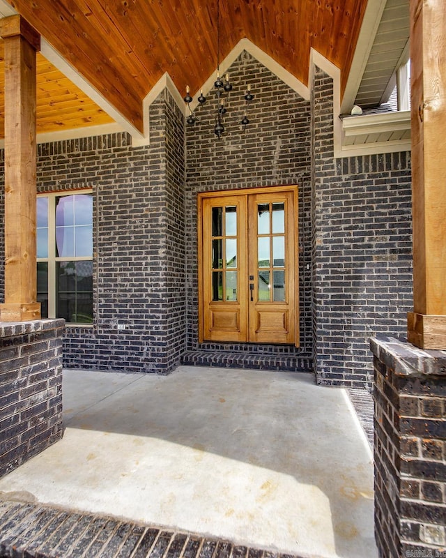19 Denali Dr, Cabot, AR 72023 - doorway to property with french doors, brick siding, and a patio area