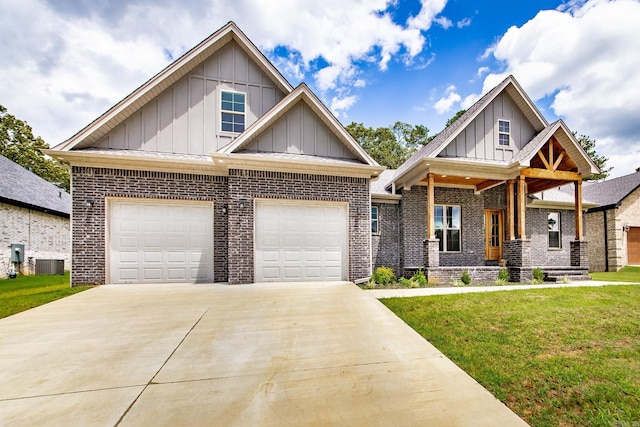 19 Denali Dr, Cabot, AR 72023 - craftsman-style home with board and batten siding, concrete driveway, a front lawn, and brick siding