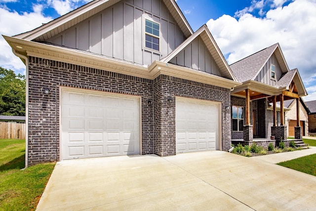 19 Denali Dr, Cabot, AR 72023 - view of front of home featuring brick siding, board and batten siding, concrete driveway, and an attached garage