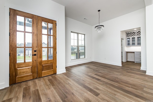 19 Denali Dr, Cabot, AR 72023 - foyer featuring french doors, wood finished floors, and a chandelier