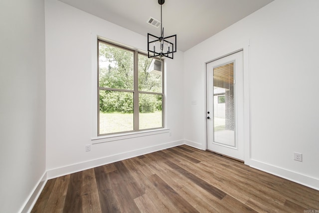 19 Denali Dr, Cabot, AR 72023 - unfurnished dining area with a chandelier and dark wood-type flooring
