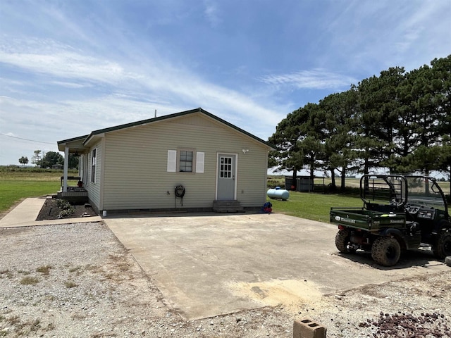 497 Law 611, Walnut Ridge, AR 72476 - rear view of house with entry steps, a lawn, and crawl space