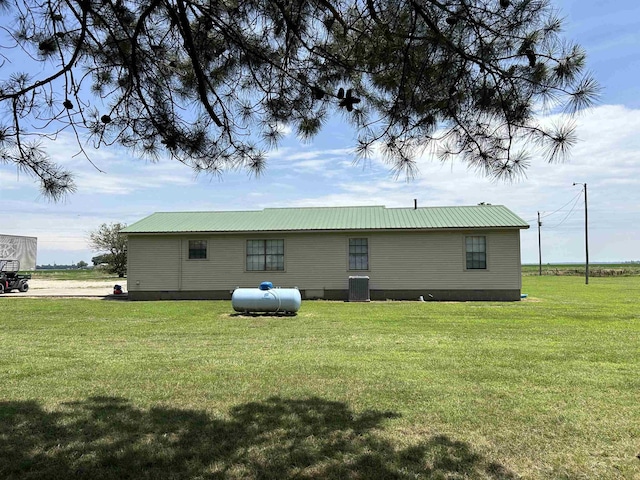 497 Law 611, Walnut Ridge, AR 72476 - rear view of property featuring crawl space, a yard, and a metal roof