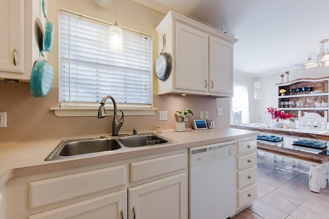 1304 Winbourne Dr, North Little Rock, AR 72116 - kitchen featuring white dishwasher, light countertops, white cabinets, and decorative light fixtures