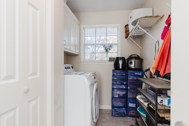 1304 Winbourne Dr, North Little Rock, AR 72116 - washroom with washer and clothes dryer, light tile patterned floors, and cabinet space