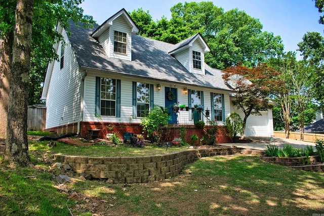1304 Winbourne Dr, North Little Rock, AR 72116 - new england style home with covered porch, driveway, and a shingled roof