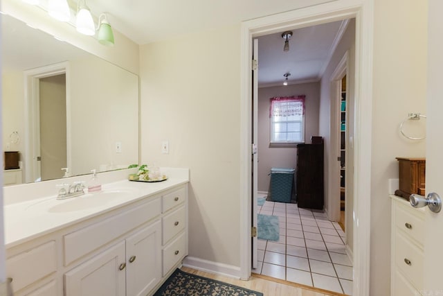1304 Winbourne Dr, North Little Rock, AR 72116 - bathroom with vanity, crown molding, and tile patterned flooring