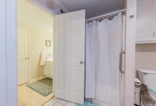 1304 Winbourne Dr, North Little Rock, AR 72116 - bathroom featuring toilet and a shower with curtain