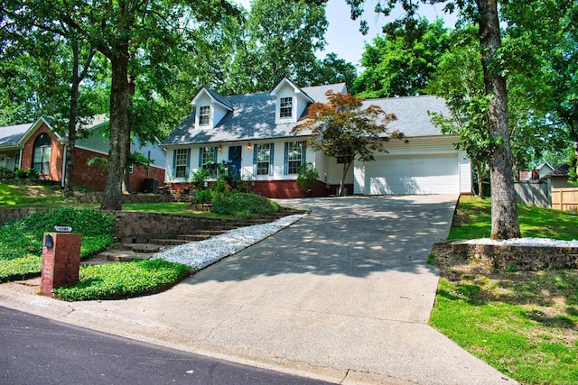 1304 Winbourne Dr, North Little Rock, AR 72116 - cape cod-style house featuring driveway and an attached garage
