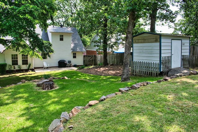 1304 Winbourne Dr, North Little Rock, AR 72116 - fenced backyard with a storage shed and a patio