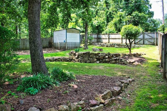 1304 Winbourne Dr, North Little Rock, AR 72116 - fenced backyard with a storage unit