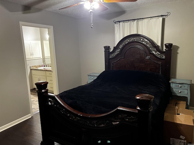 39 Dike View Dr, Heber Springs, AR 72543 - bedroom featuring dark wood finished floors, a textured ceiling, connected bathroom, and ceiling fan