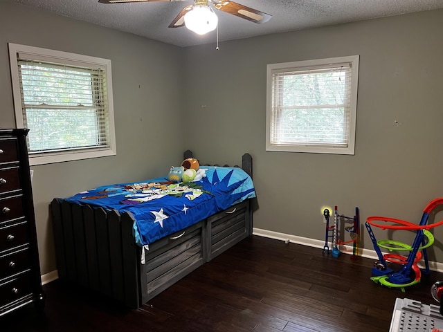 39 Dike View Dr, Heber Springs, AR 72543 - bedroom featuring dark wood-style floors, a textured ceiling, and ceiling fan