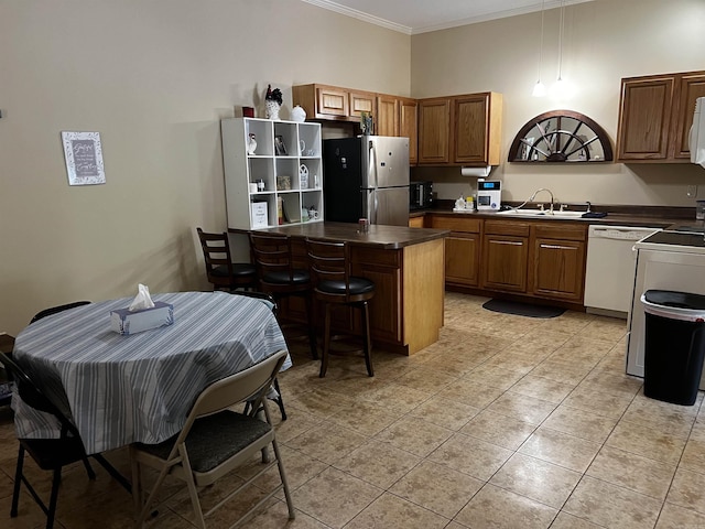39 Dike View Dr, Heber Springs, AR 72543 - kitchen with white appliances, dark countertops, crown molding, light tile patterned floors, and a breakfast bar area