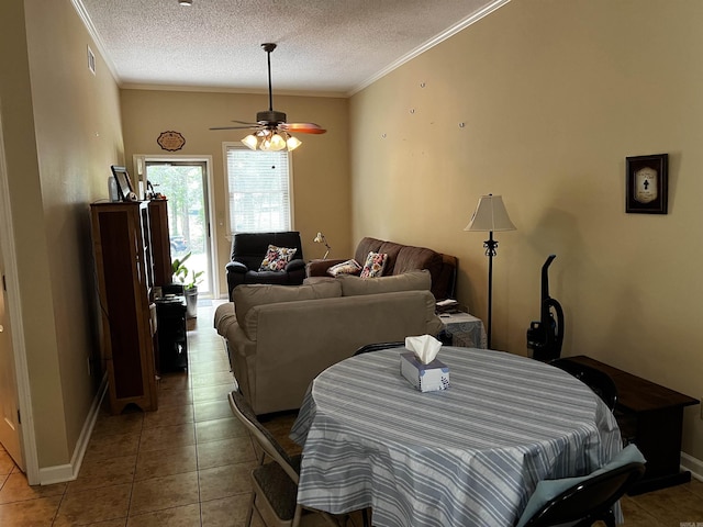 39 Dike View Dr, Heber Springs, AR 72543 - dining space with a textured ceiling, light tile patterned floors, a ceiling fan, and ornamental molding