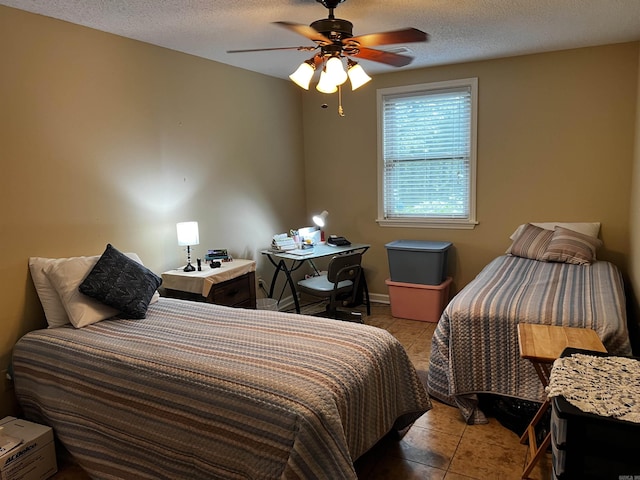 39 Dike View Dr, Heber Springs, AR 72543 - bedroom featuring light tile patterned flooring, a textured ceiling, and a ceiling fan