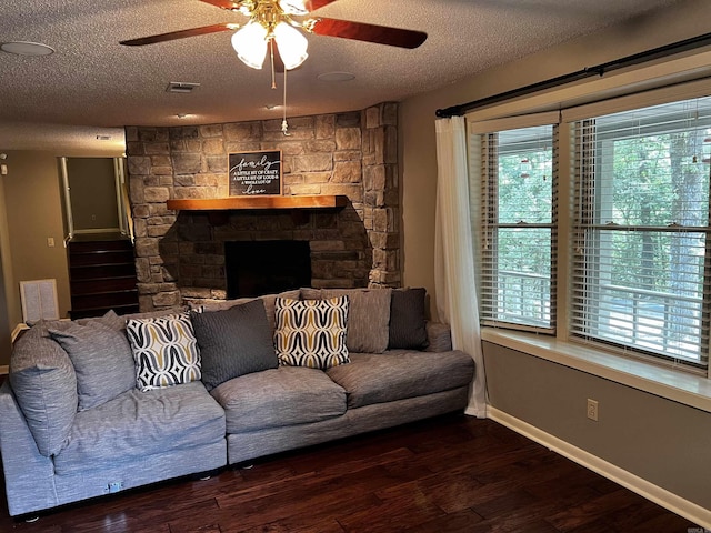39 Dike View Dr, Heber Springs, AR 72543 - living area featuring ceiling fan, a textured ceiling, wood finished floors, and a fireplace