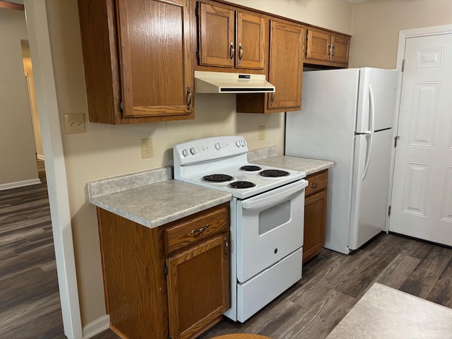 112 Sugar Maple Dr, Sherwood, AR 72120 - kitchen with white appliances, under cabinet range hood, dark wood finished floors, light countertops, and brown cabinetry