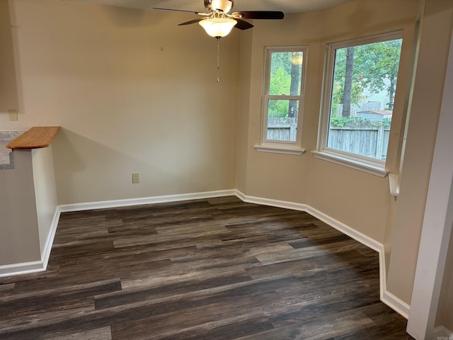 112 Sugar Maple Dr, Sherwood, AR 72120 - unfurnished dining area with a ceiling fan and dark wood-type flooring