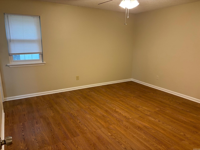 112 Sugar Maple Dr, Sherwood, AR 72120 - empty room with dark wood finished floors and a ceiling fan