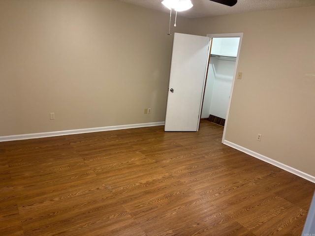 112 Sugar Maple Dr, Sherwood, AR 72120 - unfurnished bedroom featuring dark wood finished floors and ceiling fan