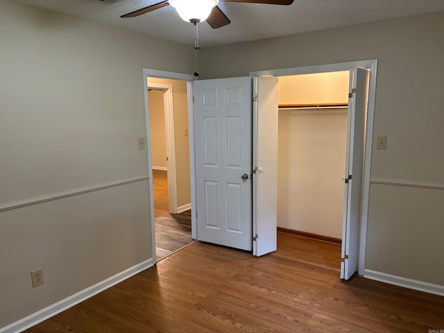 112 Sugar Maple Dr, Sherwood, AR 72120 - unfurnished bedroom with wood finished floors, a closet, and ceiling fan