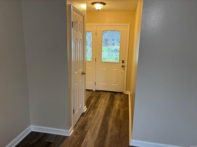112 Sugar Maple Dr, Sherwood, AR 72120 - doorway to outside with dark wood-style floors and a textured ceiling