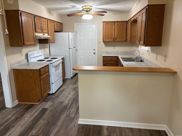 112 Sugar Maple Dr, Sherwood, AR 72120 - kitchen with white appliances, a peninsula, ceiling fan, brown cabinetry, and a textured ceiling