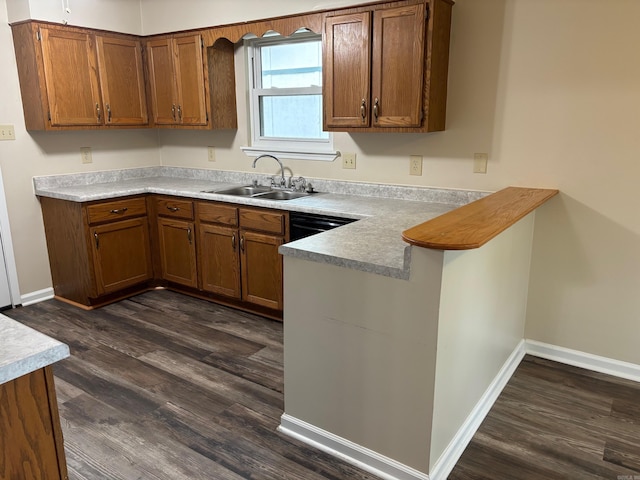 112 Sugar Maple Dr, Sherwood, AR 72120 - kitchen featuring a peninsula, brown cabinets, dark wood finished floors, and light countertops
