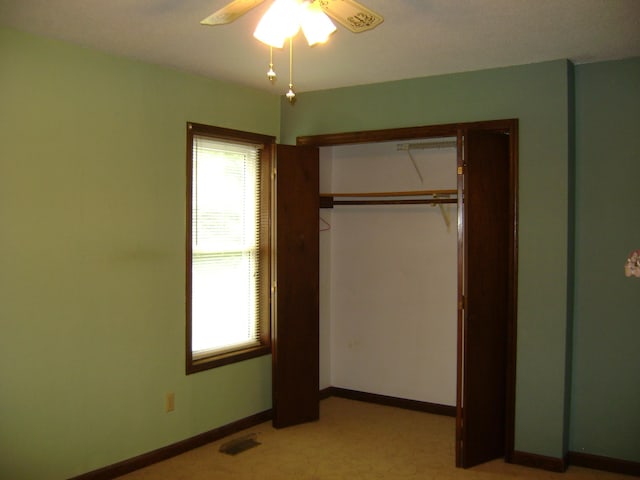 405 Fairway Dr, Horseshoe Bend, AR 72512 - unfurnished bedroom with a closet, ceiling fan, and light carpet