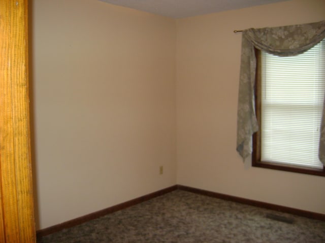 405 Fairway Dr, Horseshoe Bend, AR 72512 - carpeted empty room with baseboards