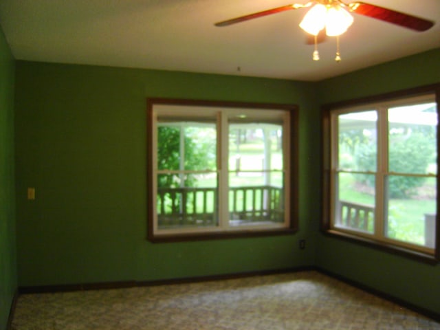 405 Fairway Dr, Horseshoe Bend, AR 72512 - spare room with plenty of natural light and ceiling fan