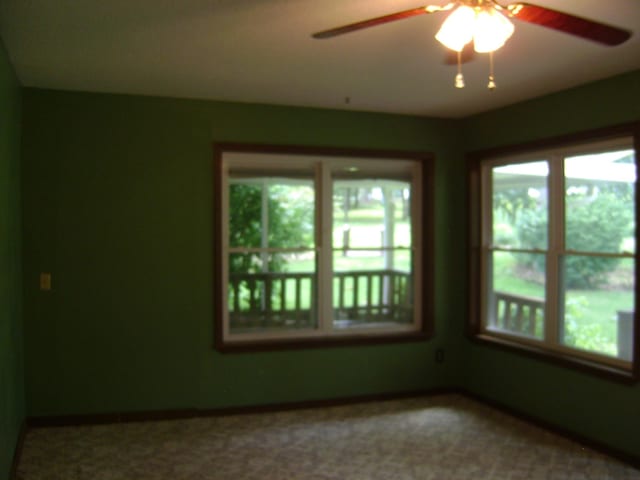 405 Fairway Dr, Horseshoe Bend, AR 72512 - unfurnished room with plenty of natural light and a ceiling fan
