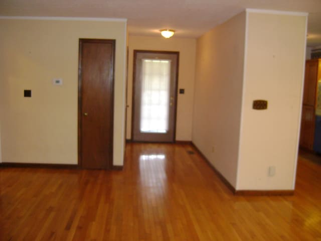 405 Fairway Dr, Horseshoe Bend, AR 72512 - foyer entrance featuring light wood-style floors