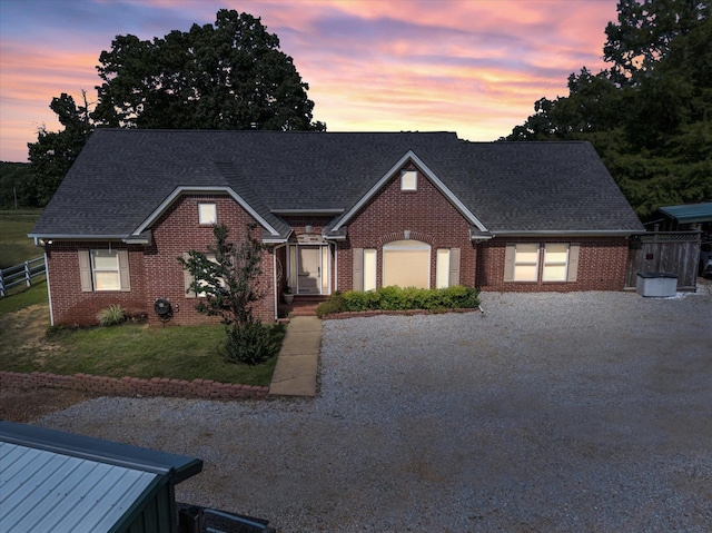 15355 Pleasant Grove Ln, Harrisburg, AR 72432 - view of front of house featuring brick siding, roof with shingles, and gravel driveway