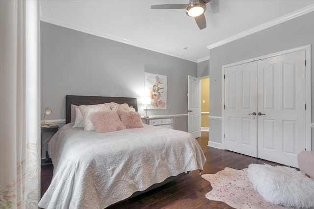 15355 Pleasant Grove Ln, Harrisburg, AR 72432 - bedroom with crown molding, dark wood finished floors, a closet, and a ceiling fan