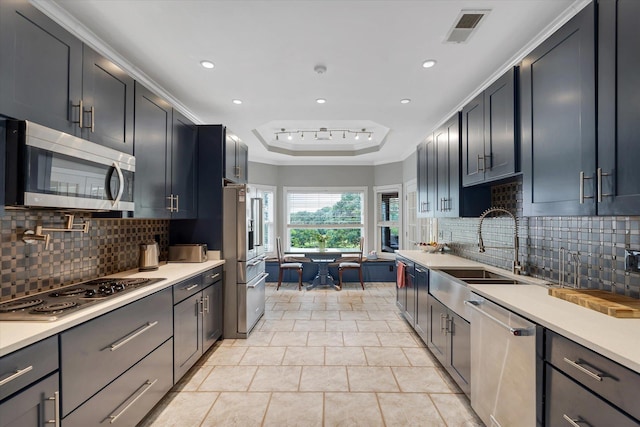15355 Pleasant Grove Ln, Harrisburg, AR 72432 - kitchen with stainless steel appliances, light countertops, backsplash, recessed lighting, and light tile patterned floors