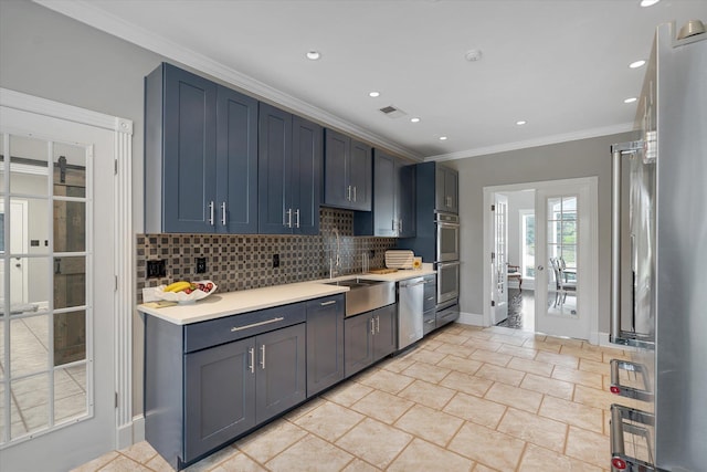 15355 Pleasant Grove Ln, Harrisburg, AR 72432 - kitchen featuring appliances with stainless steel finishes, decorative backsplash, ornamental molding, light countertops, and recessed lighting