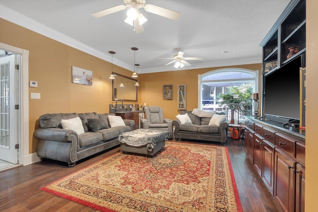15355 Pleasant Grove Ln, Harrisburg, AR 72432 - living area featuring a ceiling fan, dark wood finished floors, and ornamental molding